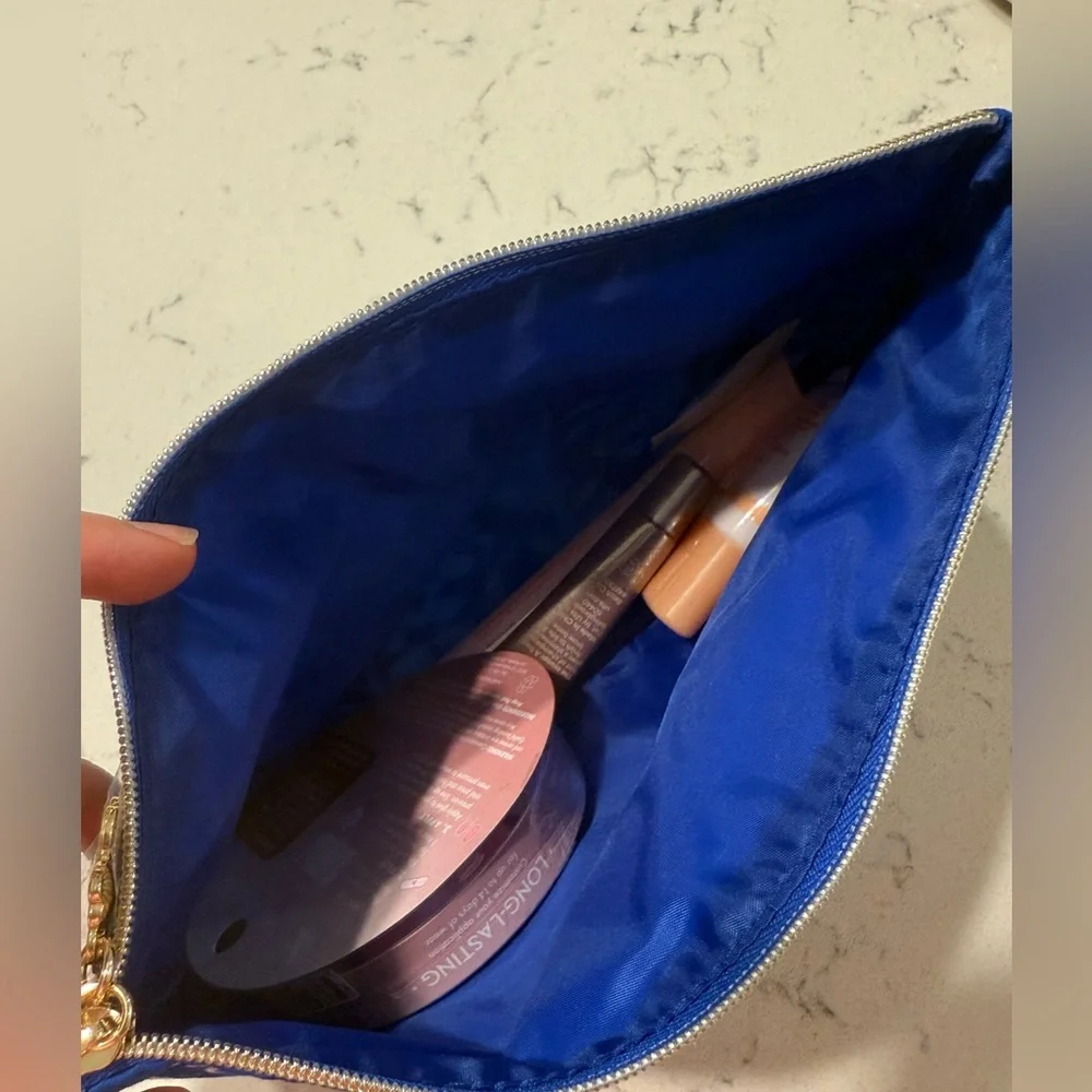 Blue and White Floral Pouch (Estee Lauder) with brand new sealed ulta products